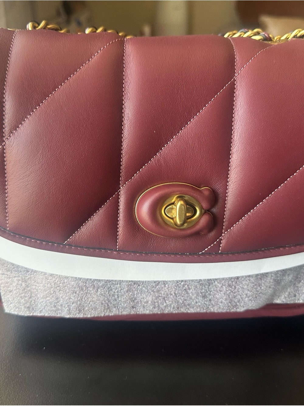 Coach quilted Madison Leather Shoulder Bag in Wine color.